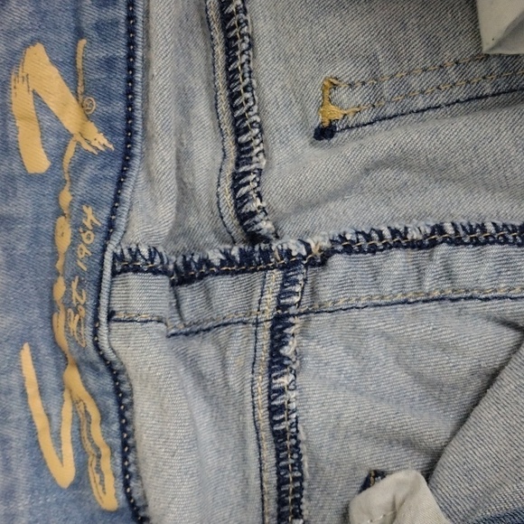 Seven7 Slim Straight Blue Light Wash Five Pocket Distressed Raw Hem Skinny Jean - Picture 8 of 16